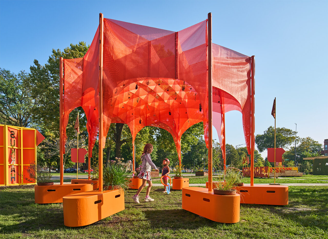 picture of awesome orange tarp with poles and in orange plant holder 8 poles 