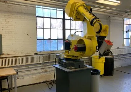 Robot Arm in DigiFab, yellow and mechanical