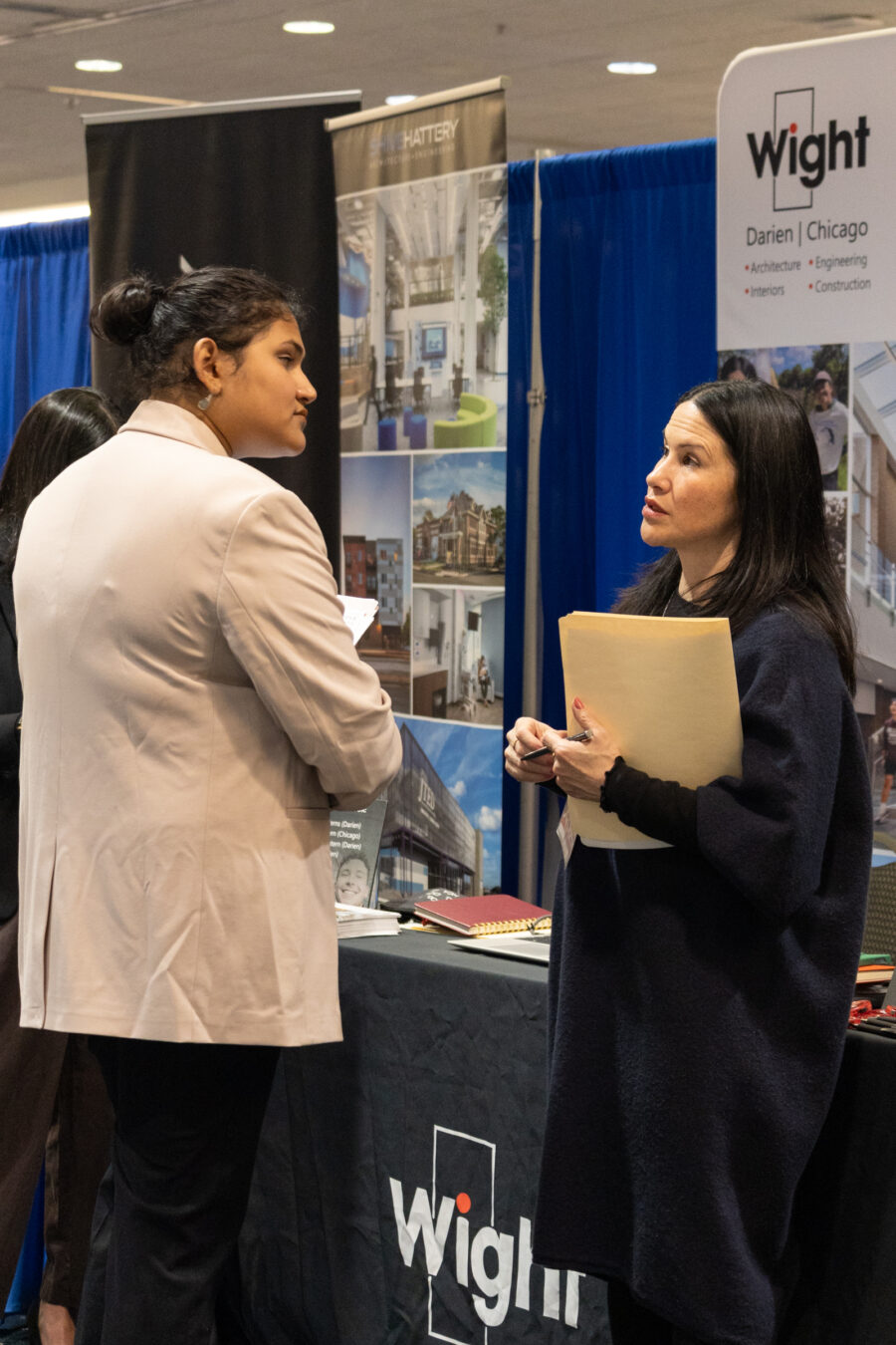 students and vendors discussing at career xpo 2025