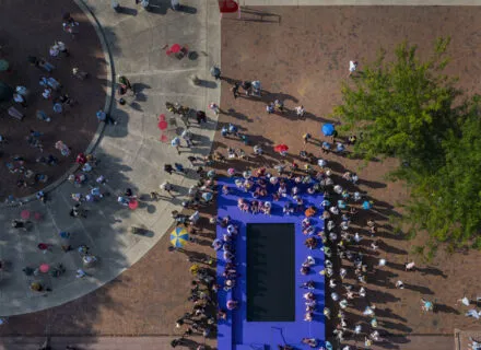 buel pool overhead shot people around it black enter
