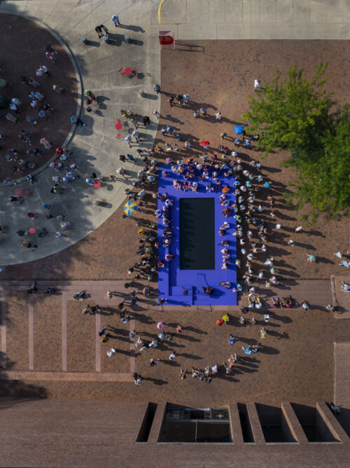 buel pool overhead shot people around it black enter