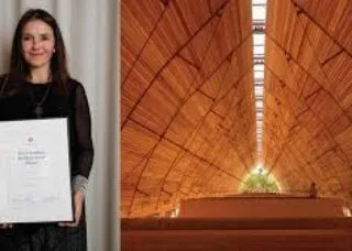 building with smiling woman