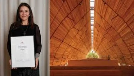 building with smiling woman