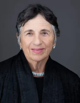 Carol Ross Barney standing next to the Chicago River