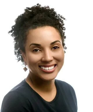 ai generated image of woman with black pigmentation and black hair smiling at camera