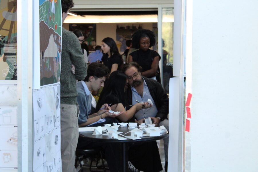 students looking at small models with reviewers