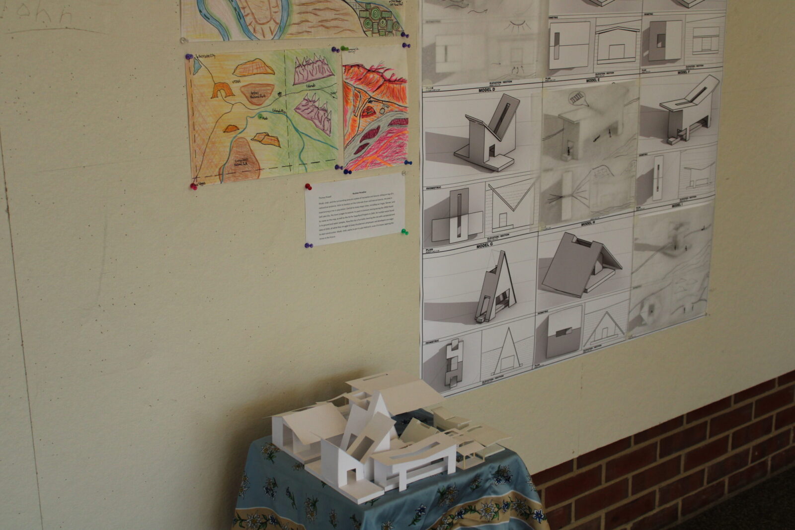 a model in front of posters