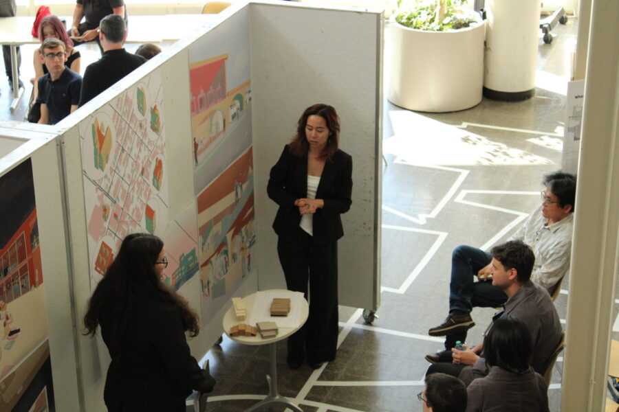 students presenting posters to an audience