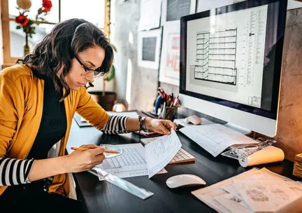 picture of woman looking down at desk
