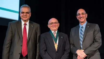 Walter Herbst with two NAI officials