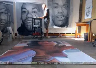 Patrick Earl Hammie in the studio with paintings