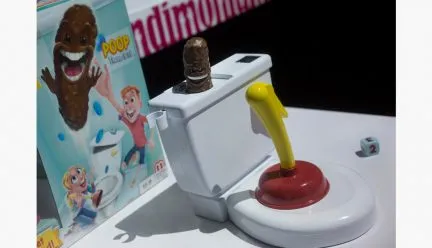 Toy toilet and plunger with poop book