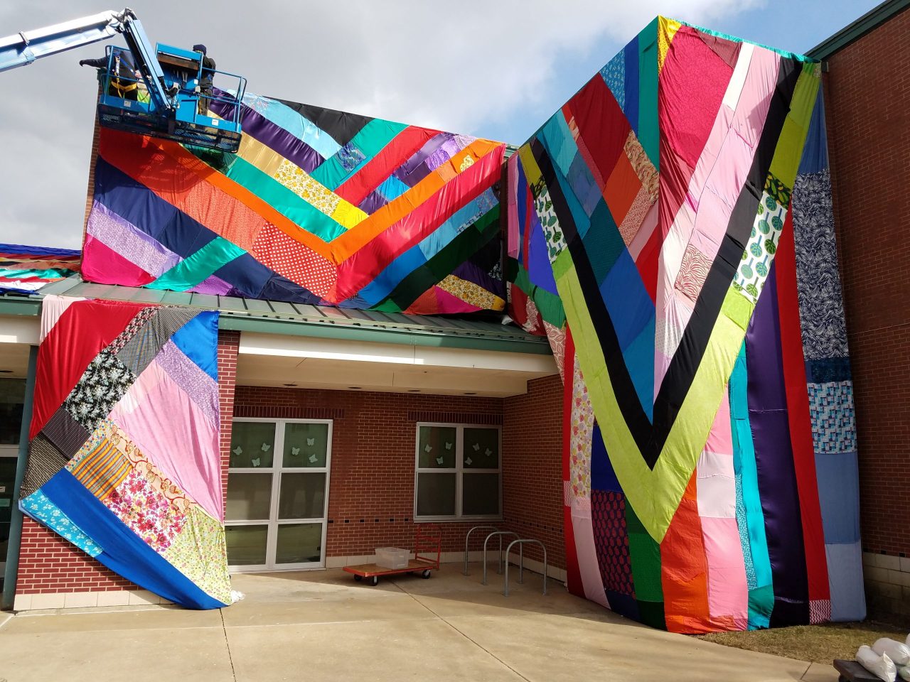 View of colorful fabric installation around the entrance of Stratton Elementary School