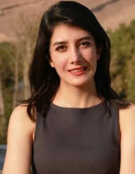 1/3 length portrait of the smiling student with arms folded