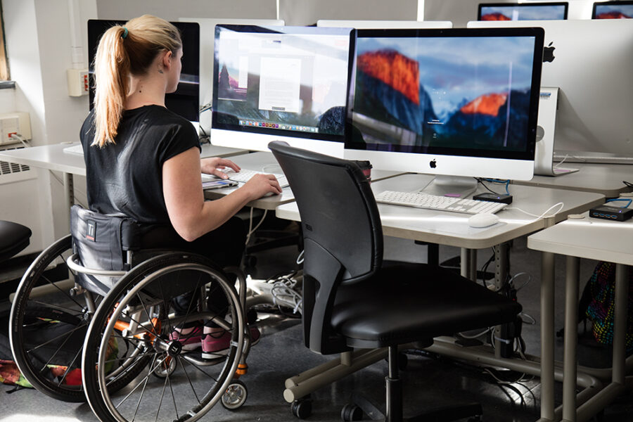 student in wheelchair uses computer