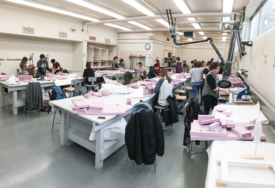 many students work with pink foam in the 3D fabrication lab