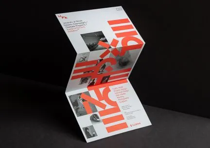 Photo of designed brochure with red letters on a light ground