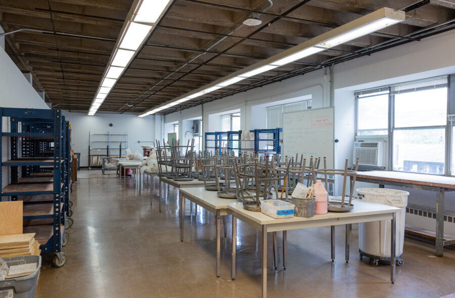 ceramics studios with stools upside down on tables