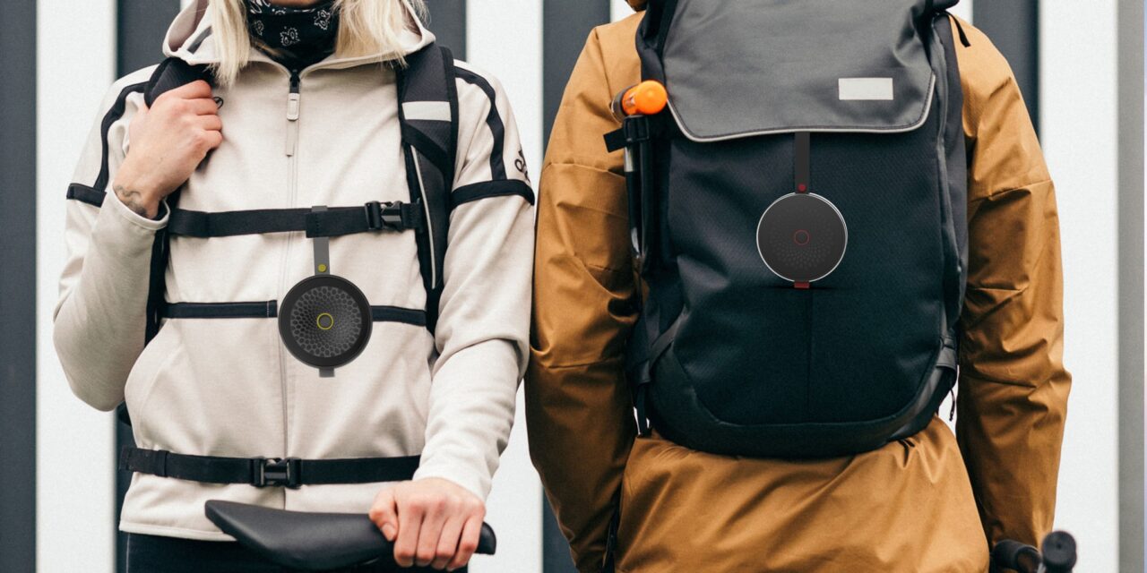2 people wearing packpacks