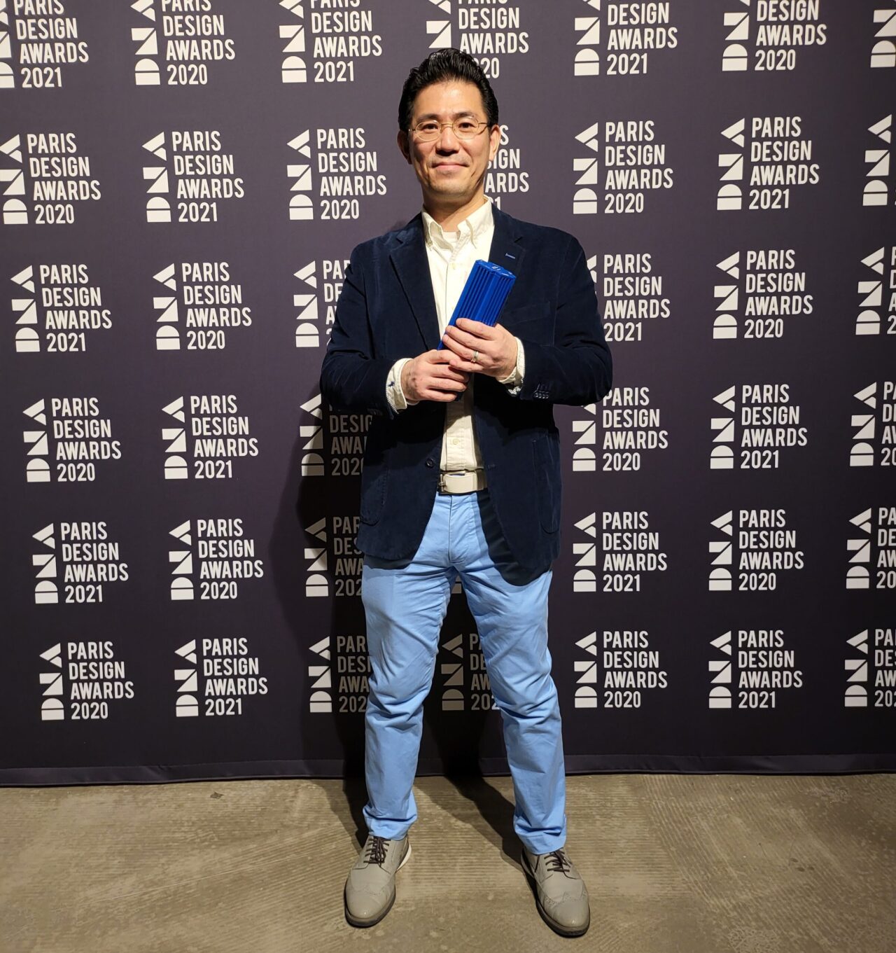 Cliff Shin holding award