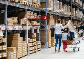 woman with shopping cart and daughter in IKEA