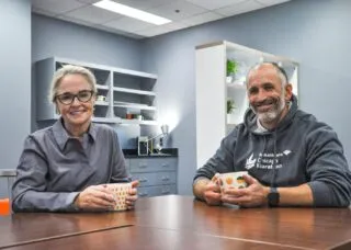 Deana McDonagh and Adam Bleakney at (dis)Ability Design Studio/table w/coffee