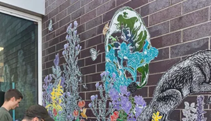 students working on mural