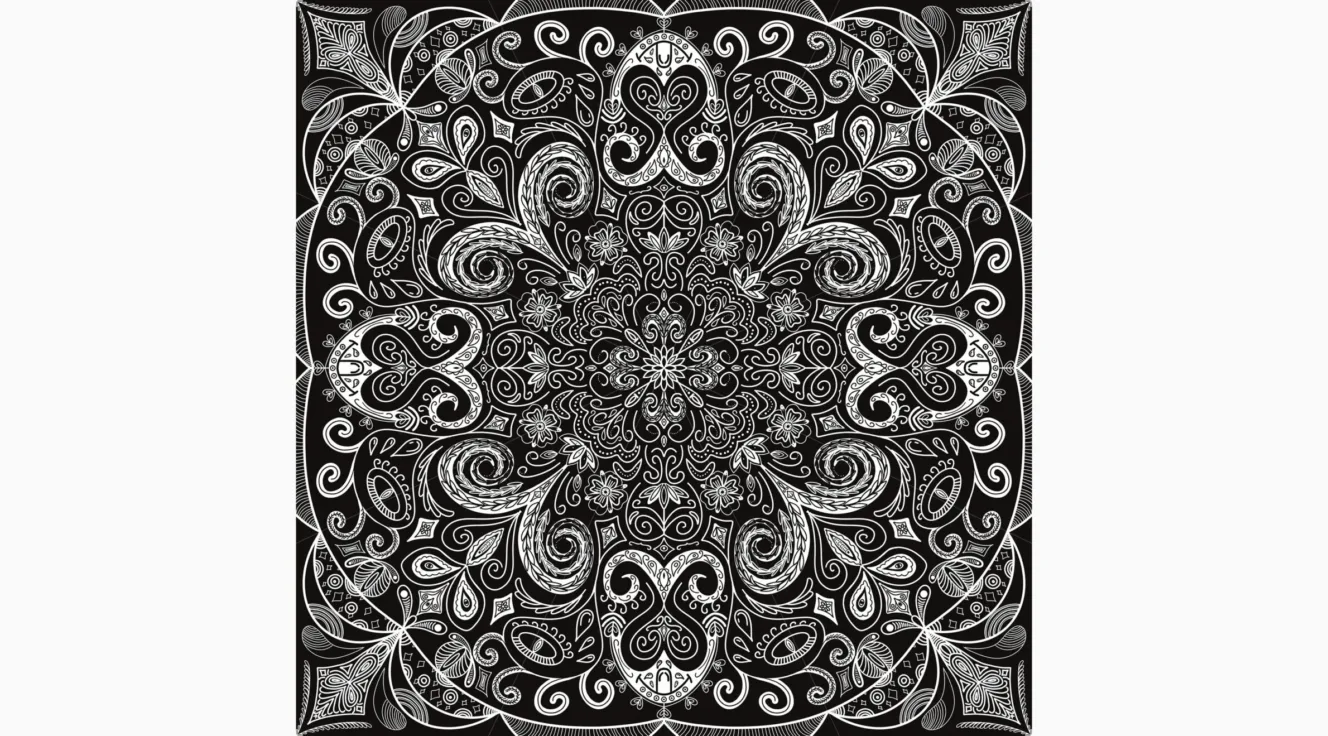 A black and white drawing of a mandala