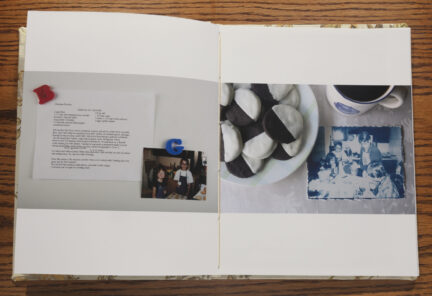 Open photo book with two images showing