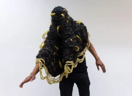 person with braided object over their head and shoulders