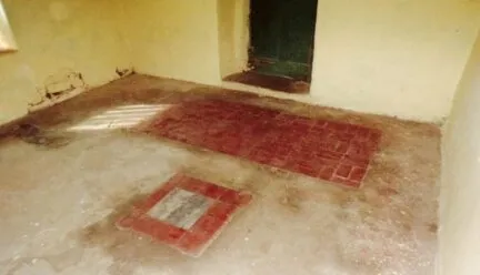 stone floor with brick inlays and open doorway