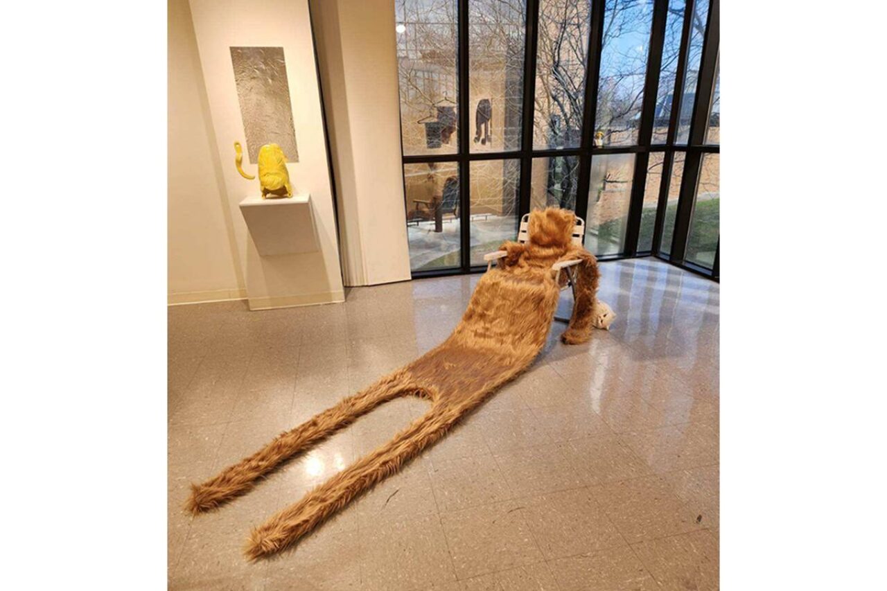 “Long Vacation,” sewn faux fur pelt, ceramic cat head 