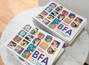 stack of catalogs for the bfa 2024 exhibition