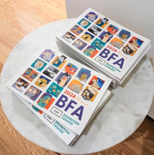 stack of catalogs for the bfa 2024 exhibition