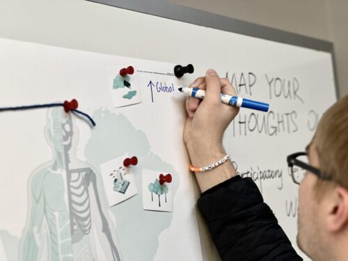 person drawing on map