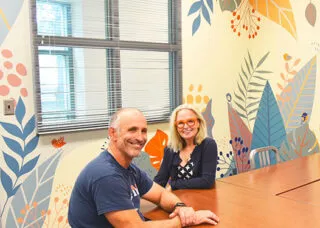 two people sit at a table