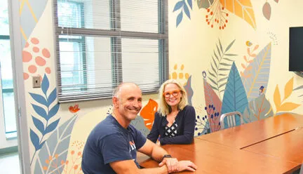 two people sit at a table