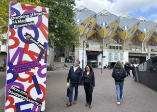 bombing in red, blue, and pink and event details in texts