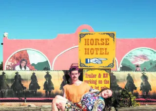 William Hohe carrying Charlotte Watson 