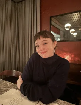 young woman at a table