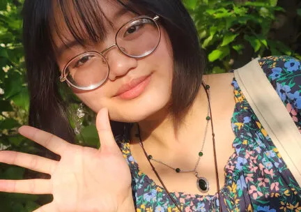 image of a student waiving