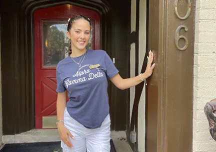 image of a student in front of a door