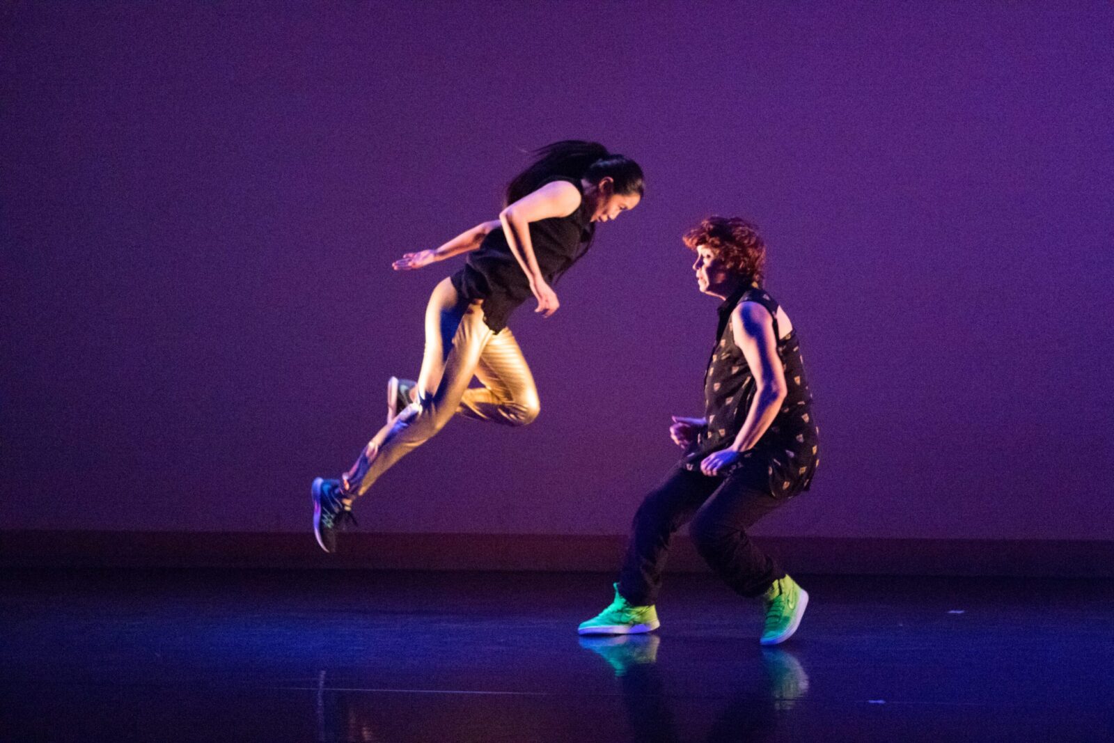 Two dancers almost colliding