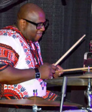 Aaron playing on the drums