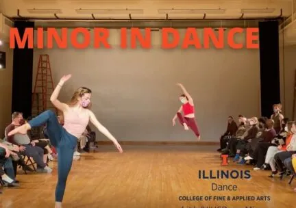 A dancer jumps in the background as another dancer balances on one leg in the foreground