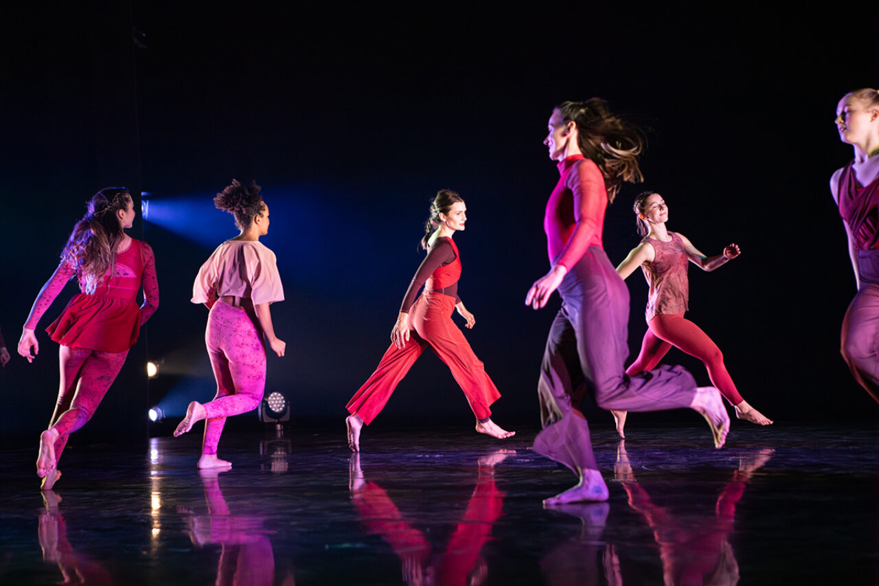 Dancers on stage wearing pink