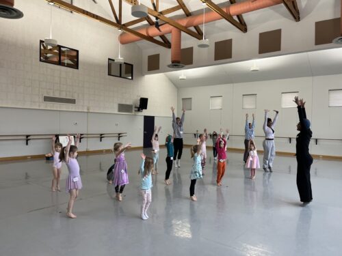Children dance inside the studio