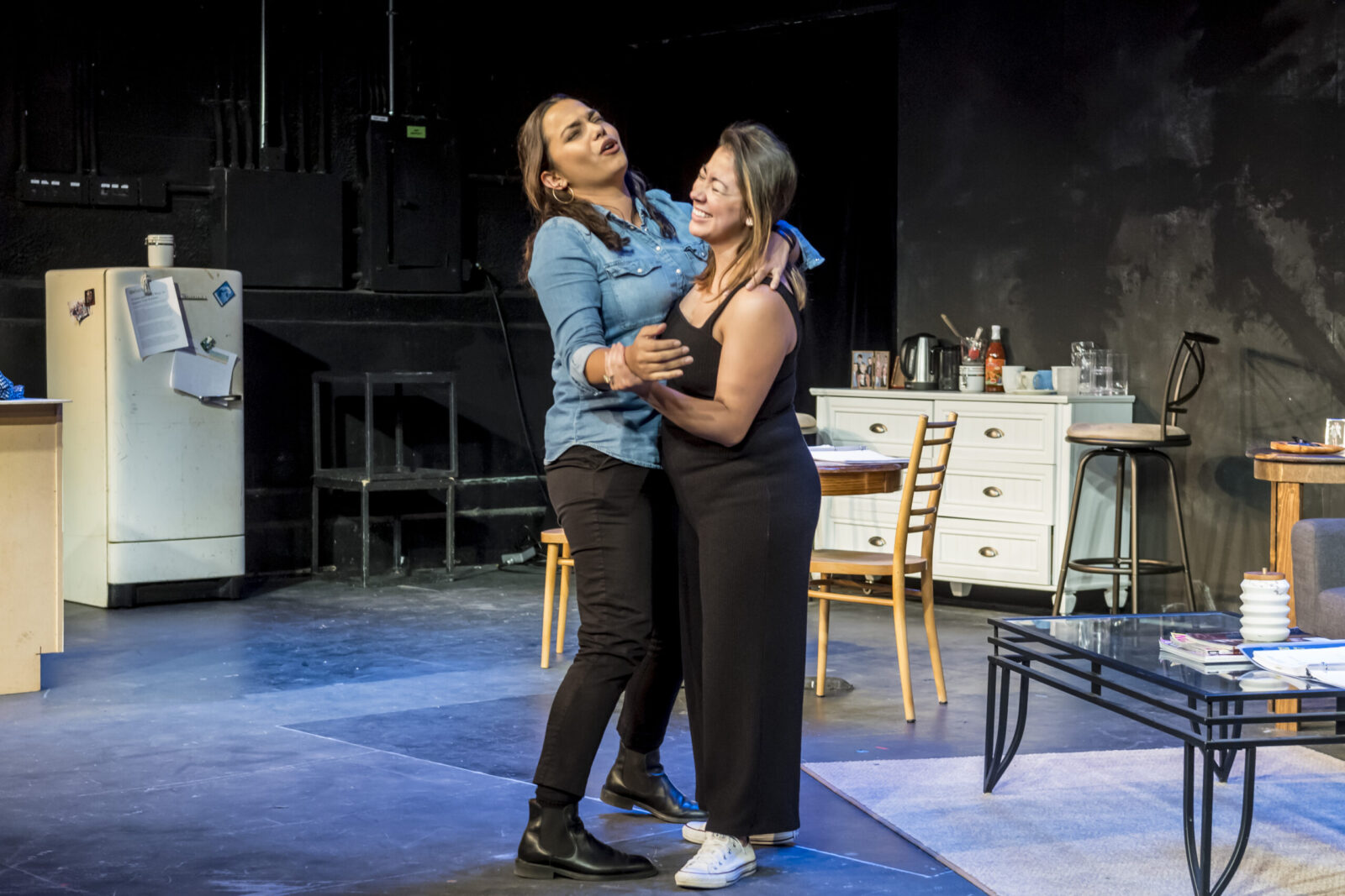 Two actors dancing together