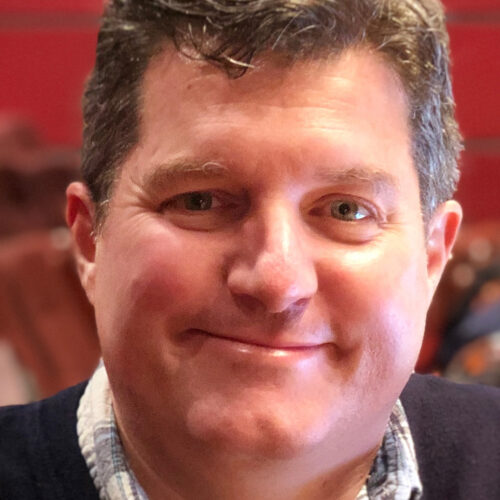 headshot of Jack Mehler smiling and looking at camera