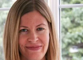 headshot of Susan Muirhead smiling and looking at the camera